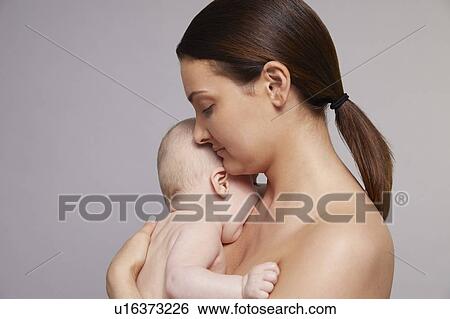 Mother hugging baby View Large Photo Image Stock Photograph - Mother hugging baby. Fotosearch