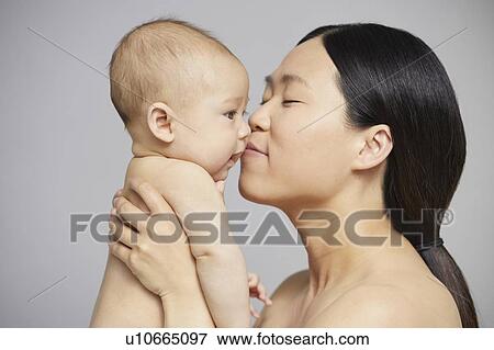 Mother nuzzling baby boy View Large Photo Image Stock Photo - Mother nuzzling baby boy. Fotosearch
