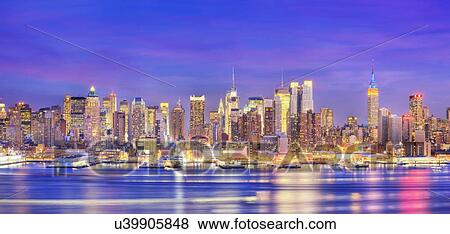 Stock Photo - New York City, USA, at dusk. Fotosearch