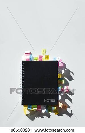 Stock Image - Notepad full of sticky notes. Fotosearch
