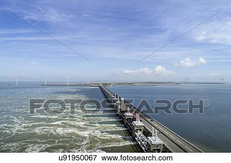 Oosterschelde flood barrier, Vrouwenpolder, Zeeland, Netherlands View Large Photo Image Stock Photo - Oosterschelde flood barrier, Vrouwenpolder, Zeeland, Netherlands. Fotosearch