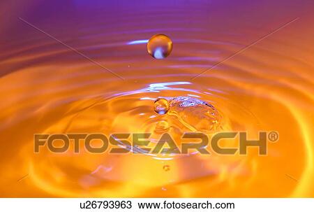 Orange and purple splashing water View Large Photo Image Stock Image - Orange and purple splashing water. Fotosearch