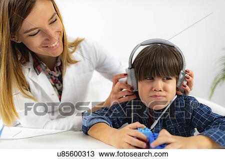 Stock Image - Paediatric hearing test. Fotosearch