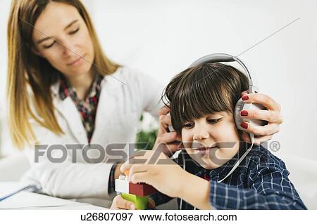 Stock Photo - Paediatric hearing test. Fotosearch