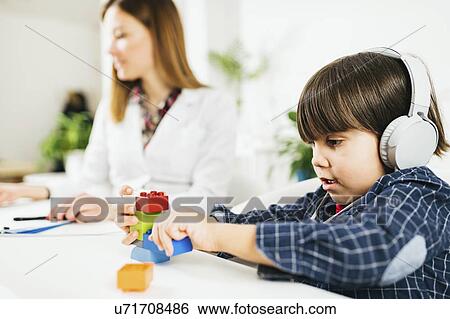 Stock Photograph - Paediatric hearing test. Fotosearch