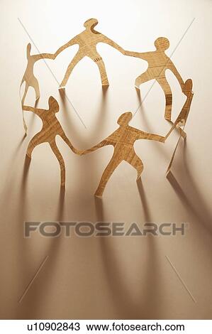 Paper dolls holding hands View Large Photo Image Stock Image - Paper dolls holding hands. Fotosearch