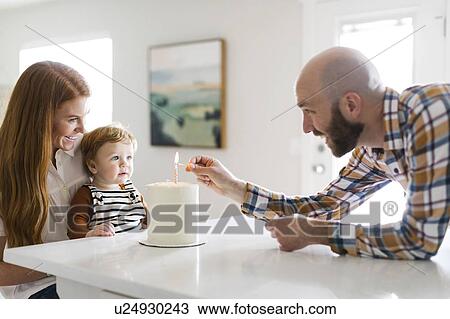 Parents and son with birthday cake View Large Photo Image Stock Image - Parents and son with birthday cake. Fotosearch