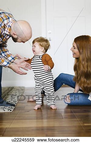 Parents with their crying son View Large Photo Image Stock Photo - Parents with their crying son. Fotosearch