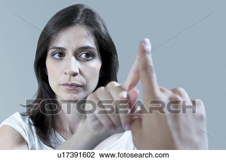 Stock Image - Patient undergoing finger to nose test. Fotosearch