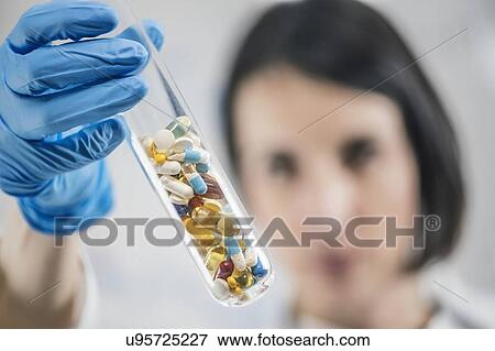 Pharmaceuticals glass test tube filled with colourful pills View Large Photo Image Stock Photo - Pharmaceuticals glass test tube filled with colourful pills. Fotosearch