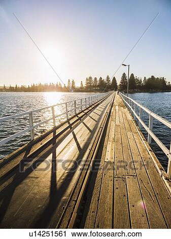 Stock Image - Pier at sunset on Victor Harbor in South Australia, Australia. Fotosearch