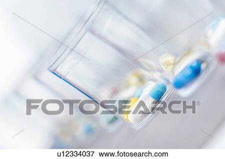 Pills in a disposable plastic cup View Large Photo Image Stock Photo - Pills in a disposable plastic cup. Fotosearch