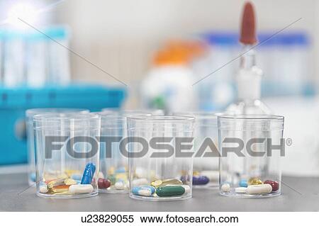 Pills in a disposable plastic cup View Large Photo Image Stock Photography - Pills in a disposable plastic cup. Fotosearch