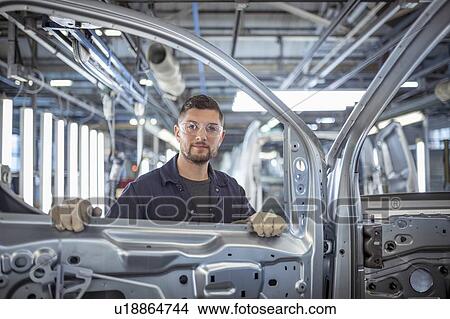 Portrait of car body inspector in car factory View Large Photo Image Picture - Portrait of car body inspector in car factory. Fotosearch