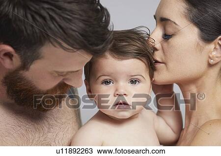 Portrait of couple and baby girl View Large Photo Image Stock Image - Portrait of couple and baby girl. Fotosearch