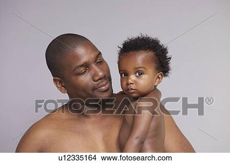 Portrait of father and baby boy View Large Photo Image Picture - Portrait of father and baby boy. Fotosearch