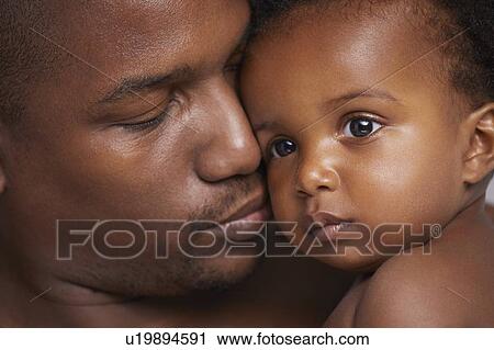 Stock Image - Portrait of father and baby boy. Fotosearch