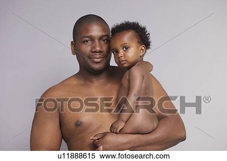Portrait of father and baby boy View Large Photo Image Stock Photography - Portrait of father and baby boy. Fotosearch