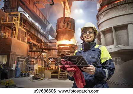 Portrait of female steelworker during steel pour in steelworks View Large Photo Image Stock Photograph - Portrait of female steelworker during steel pour in steelworks. Fotosearch