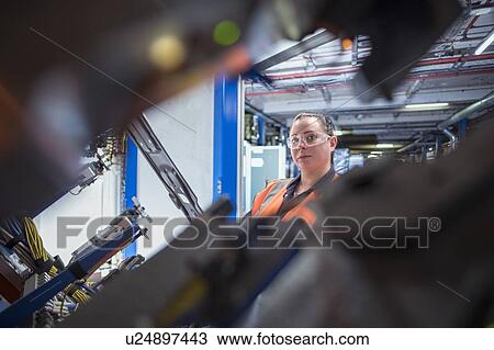 Portrait of female worker assembling vehicle roofs in car factory View Large Photo Image Stock Image - Portrait of female worker assembling vehicle roofs in car factory. Fotosearch