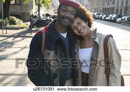 Stock Image - Portrait of loving couple in street, Milan, Italy. Fotosearch