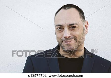 Stock Image - Portrait of mature man with stubble. Fotosearch