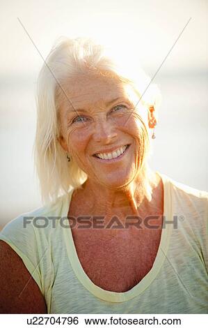 Stock Photograph - Portrait of mature woman smiling. Fotosearch