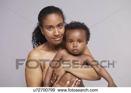 Stock Photo - Portrait of mother and baby boy. Fotosearch