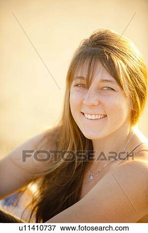 Stock Photo - Portrait of smiling young woman. Fotosearch
