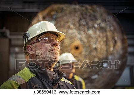 Stock Image - Portrait of steelworkers in steelworks. Fotosearch