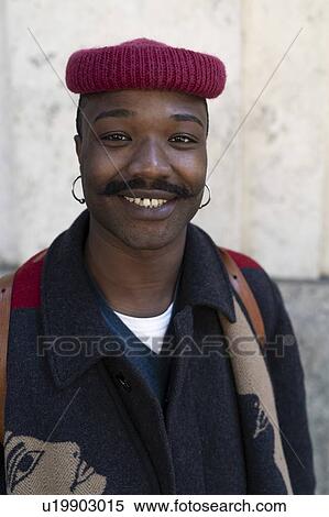 Stock Photography - Portrait of stylish man with hat. Fotosearch