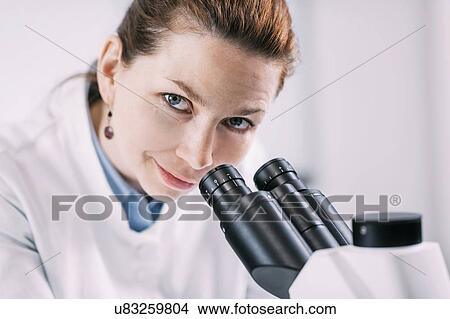Portrait of young female archaeologist with microscope View Large Photo Image Picture - Portrait of young female archaeologist with microscope. Fotosearch