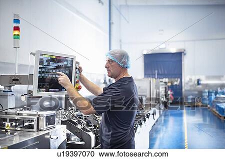 Printer using control screen of food packaging printing machine in print factory View Large Photo Image Stock Image - Printer using control screen of food packaging printing machine in print factory. Fotosearch