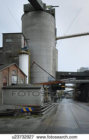 Stock Photo - Public road runs through vast cement factory, Slite, Gotlands Lan, Sweden. Fotosearch