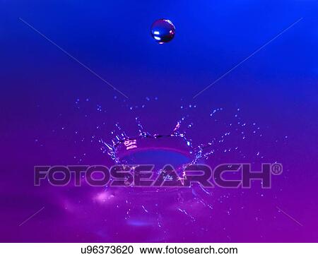 Stock Image - Purple and blue splashing water. Fotosearch