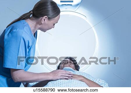 Radiographer comforting patient View Large Photo Image Stock Image - Radiographer comforting patient. Fotosearch