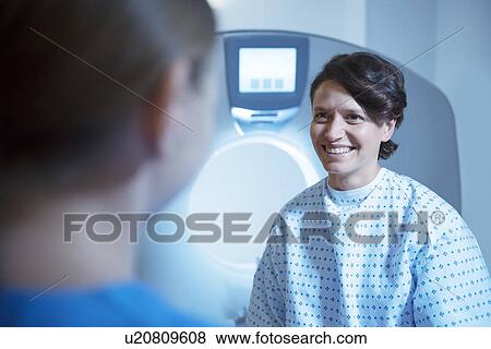Radiographer preparing patient for CT scan View Large Photo Image Stock Photo - Radiographer preparing patient for CT scan. Fotosearch