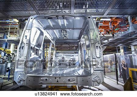Stock Image - Rear view of van body on production line in car factory. Fotosearch