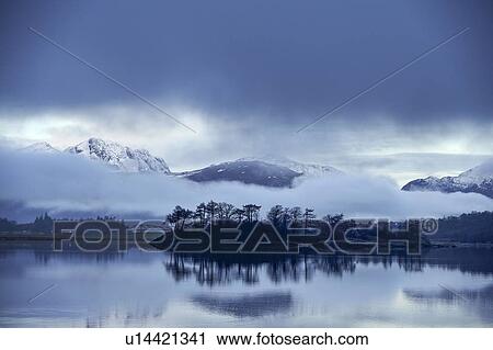 Reflection of trees and mountains in lake, Scottish Borders, United Kingdom View Large Photo Image Stock Image - Reflection of trees and mountains in lake, Scottish Borders, United Kingdom. Fotosearch
