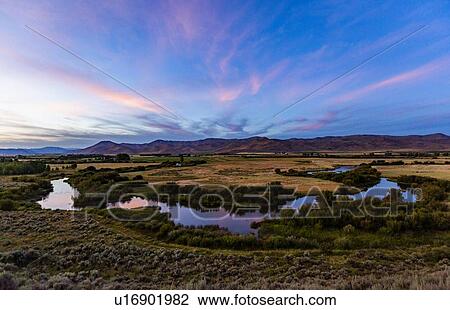Stock Image - River at sunset in Picabo, Idaho, USA. Fotosearch