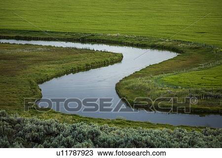 River through fields in Picabo, Idaho, USA View Large Photo Image Stock Image - River through fields in Picabo, Idaho, USA. Fotosearch