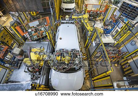 Robots on car production line in car factory View Large Photo Image Stock Image - Robots on car production line in car factory. Fotosearch