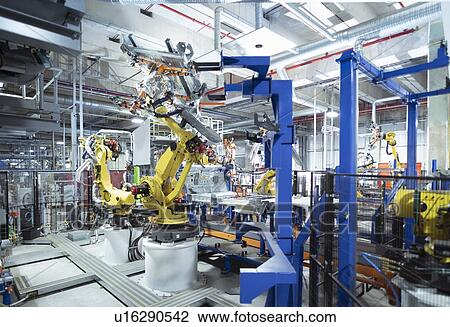 Robots spot welding car parts in car factory View Large Photo Image Stock Image - Robots spot welding car parts in car factory. Fotosearch