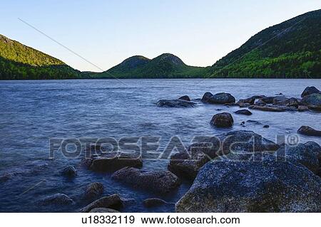 Rocks in Jordan Pond by hills in Acadia National Park, Maine, USA View Large Photo Image Stock Photo - Rocks in Jordan Pond by hills in Acadia National Park, Maine, USA. Fotosearch