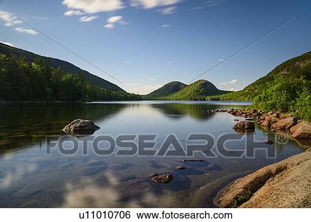 Rocks in Jordan Pond by hills in Acadia National Park, Maine, USA View Large Photo Image Stock Photograph - Rocks in Jordan Pond by hills in Acadia National Park, Maine, USA. Fotosearch