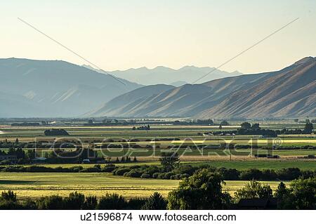Rural landscape by mountains in Picabo, Idaho, USA View Large Photo Image Picture - Rural landscape by mountains in Picabo, Idaho, USA. Fotosearch