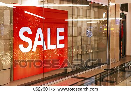 Stock Photography - Sale banner in shop window. Fotosearch