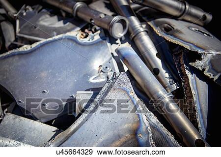 Stock Photo - Scrap titanium aircraft parts in titanium recycling plant. Fotosearch