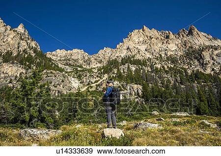 Stock Photo - Senior man hiking on Sawtooth Mountains in Stanley, Idaho, USA. Fotosearch