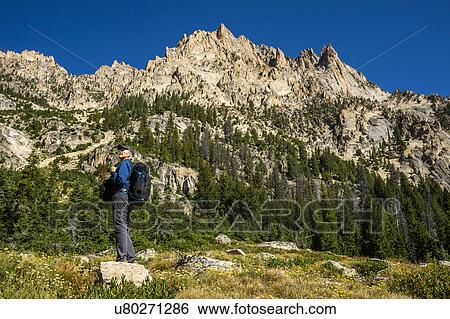 Stock Photograph - Senior man hiking on Sawtooth Mountains in Stanley, Idaho, USA. Fotosearch